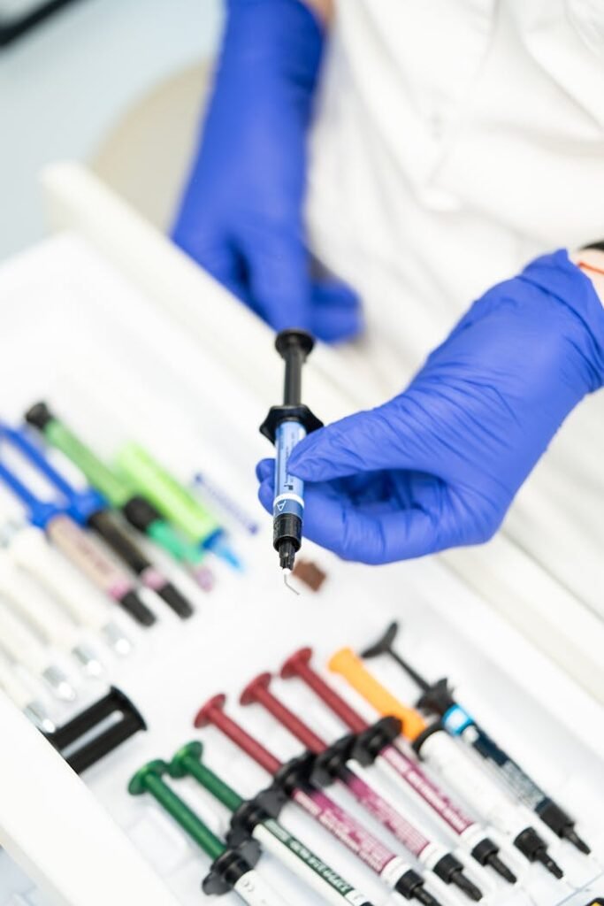 Hand Holding a Disposable Syringe